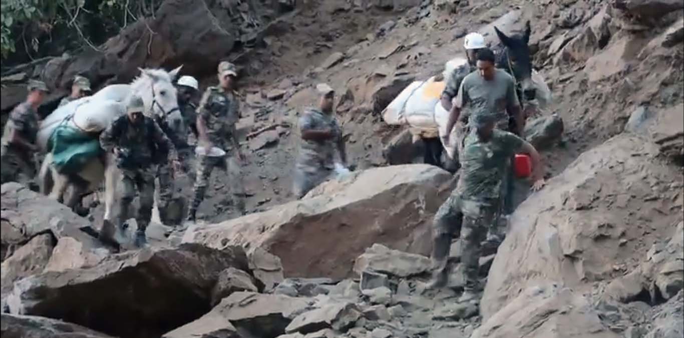 Braving the rugged terrain and aftershocks to bring relief to quake-affected villagers