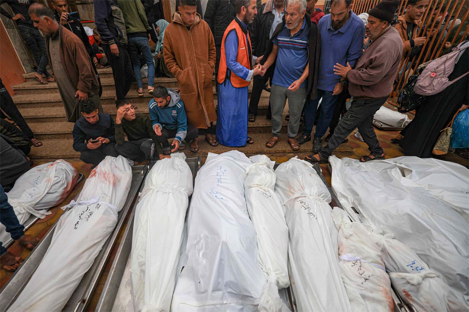 Palestinians mourn the death of loved ones following Israeli bombardment in the southern Gaza Strip