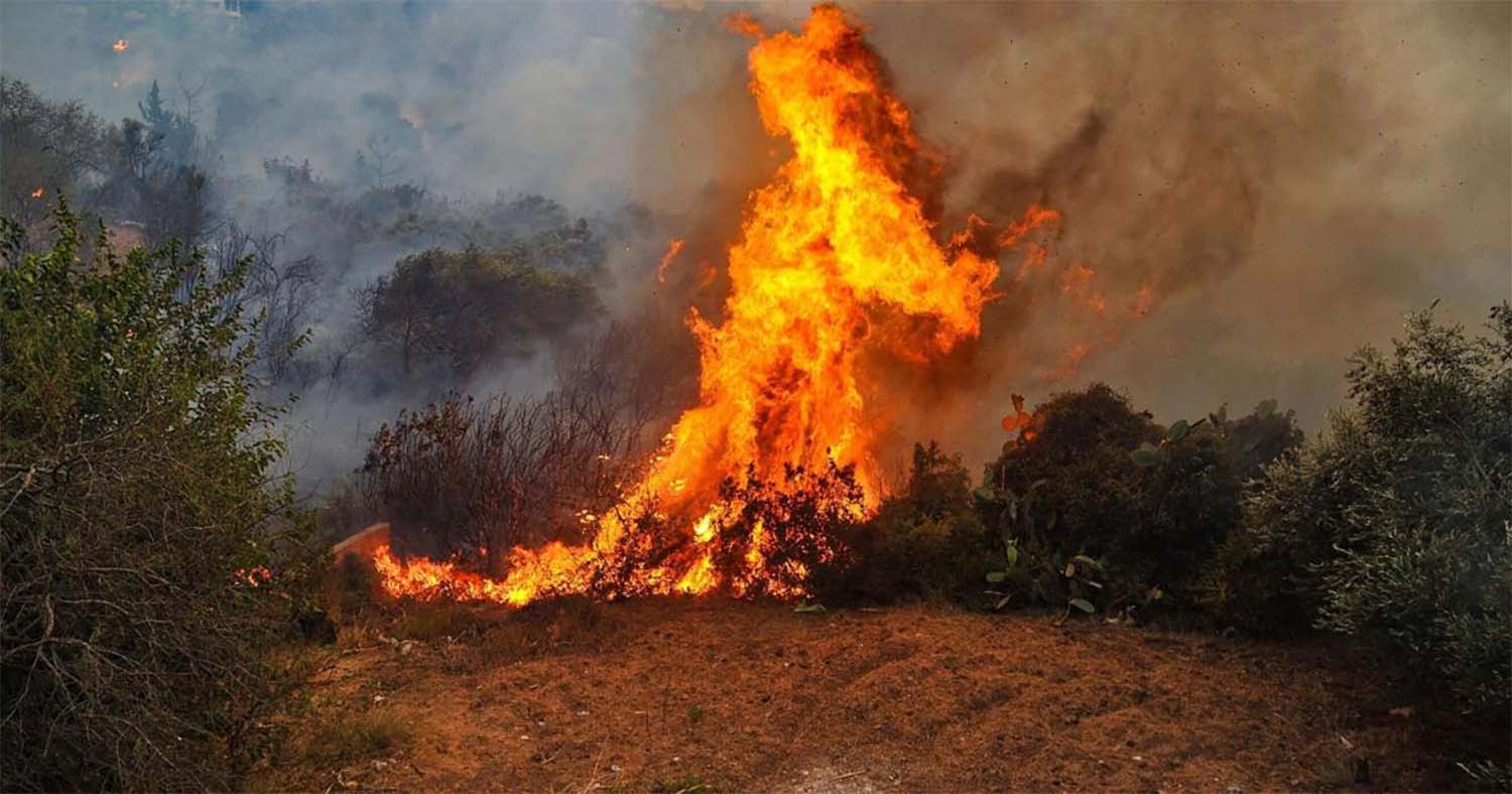 Flames engulfing tracts of land 