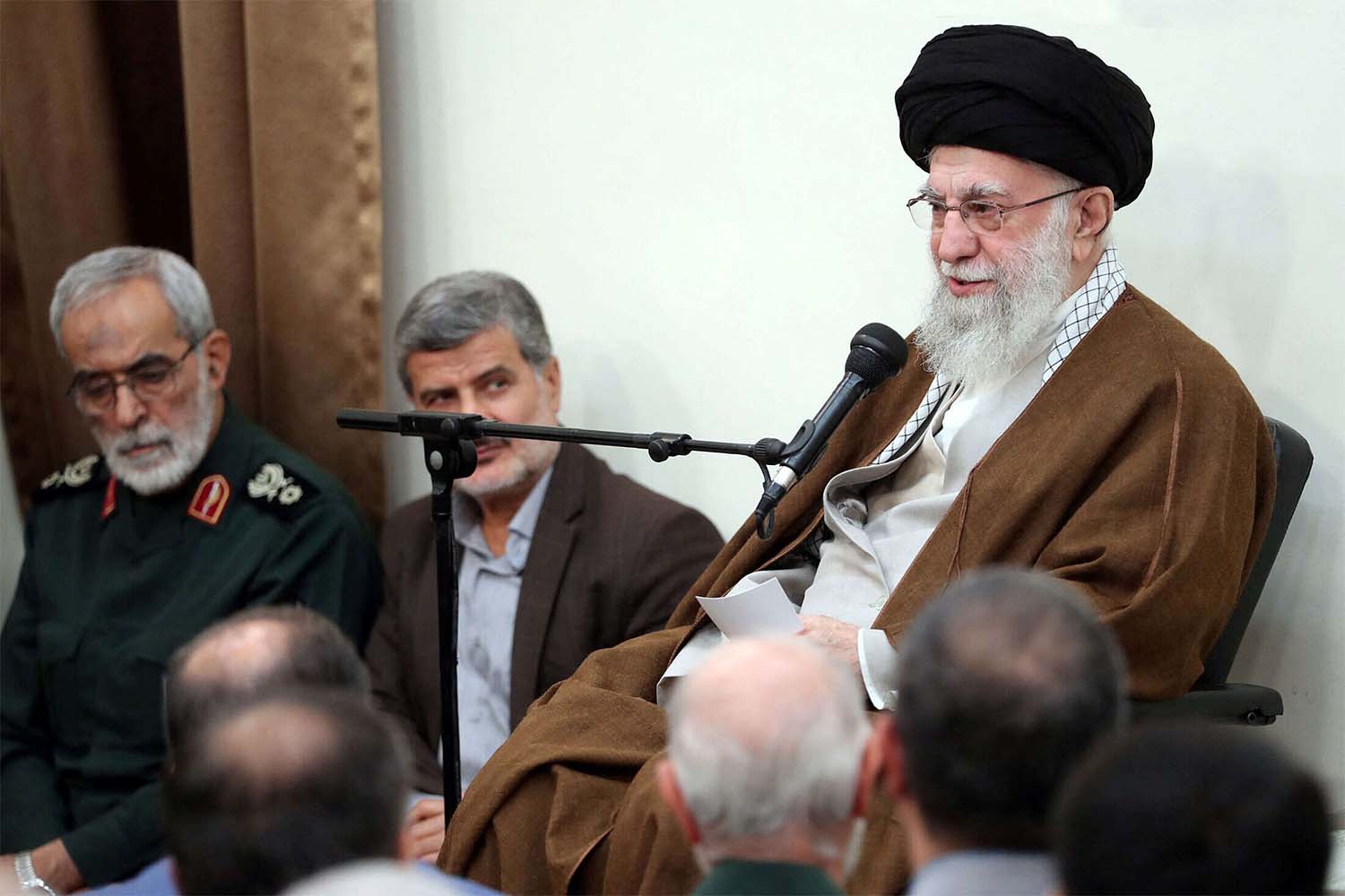 Iran's supreme leader (R) Ayatollah Ali Khamenei 