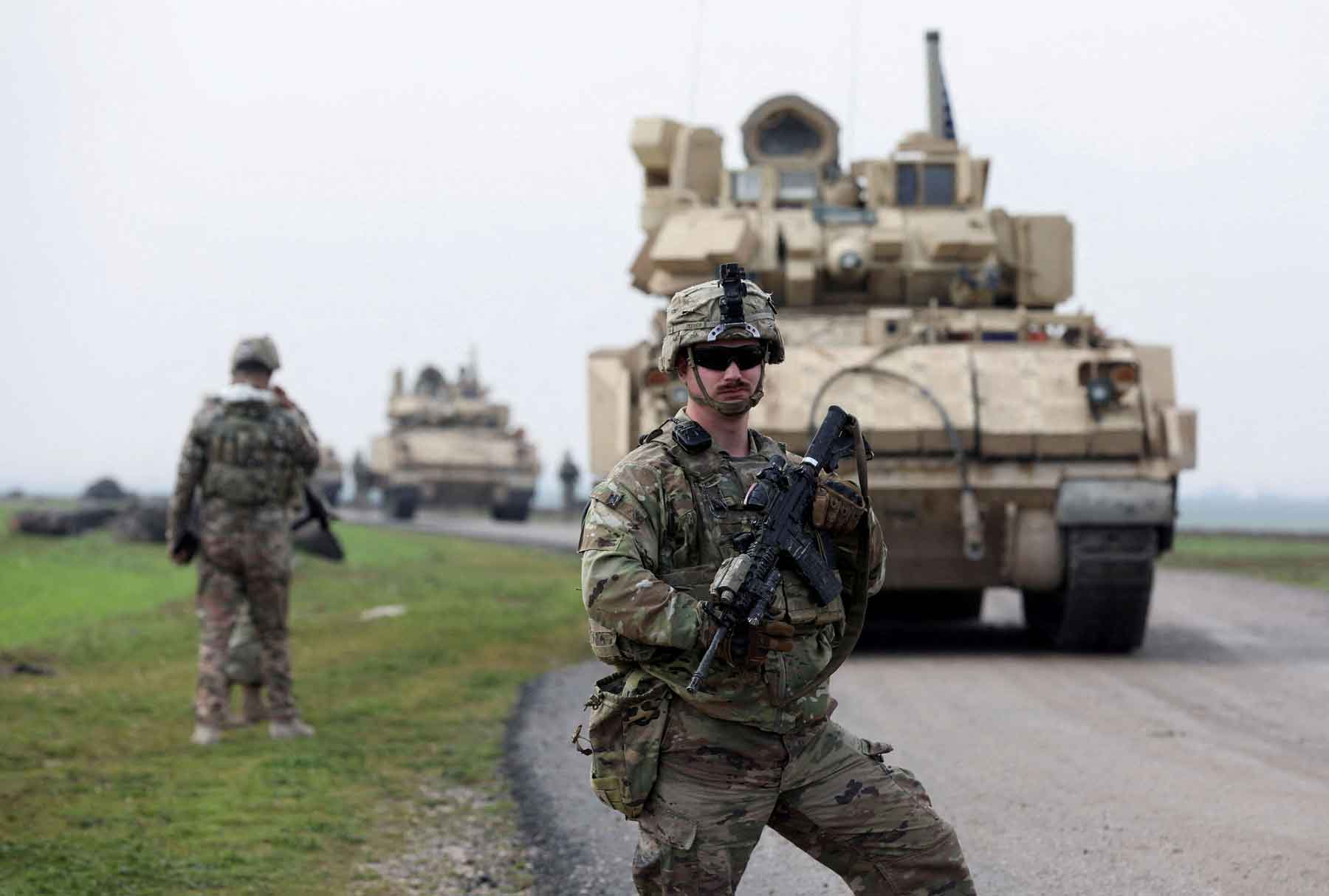 A soldier from the US-led coalition stands guard in the countryside of Qamishli in northeastern Syria, February 8, 2024. 