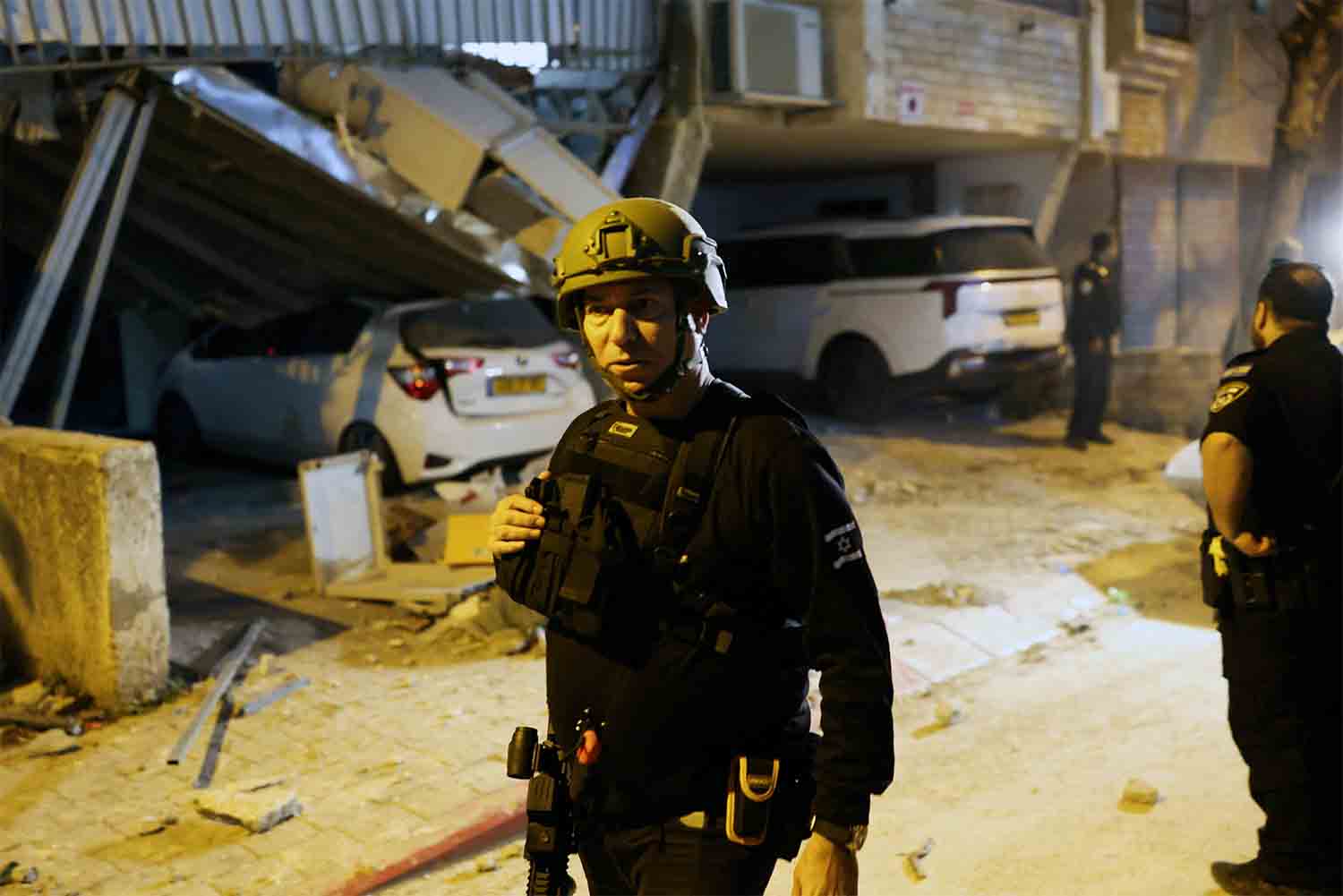 Emergency personnel respond following Iranian missile barrages in central Israel