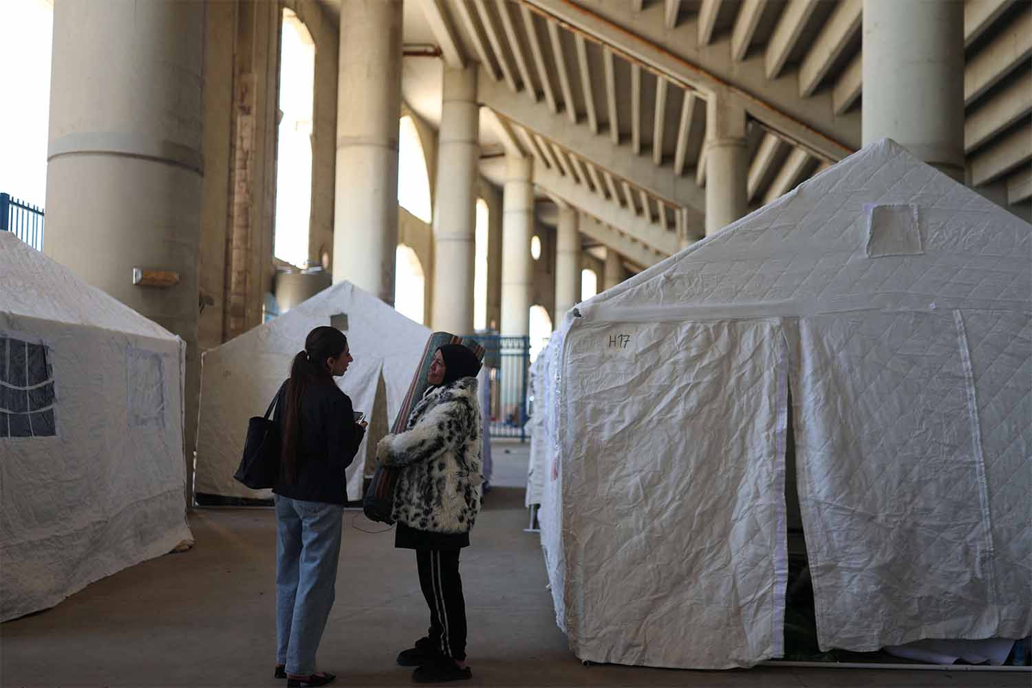 Displaced women shelter in a stadium in Beirut