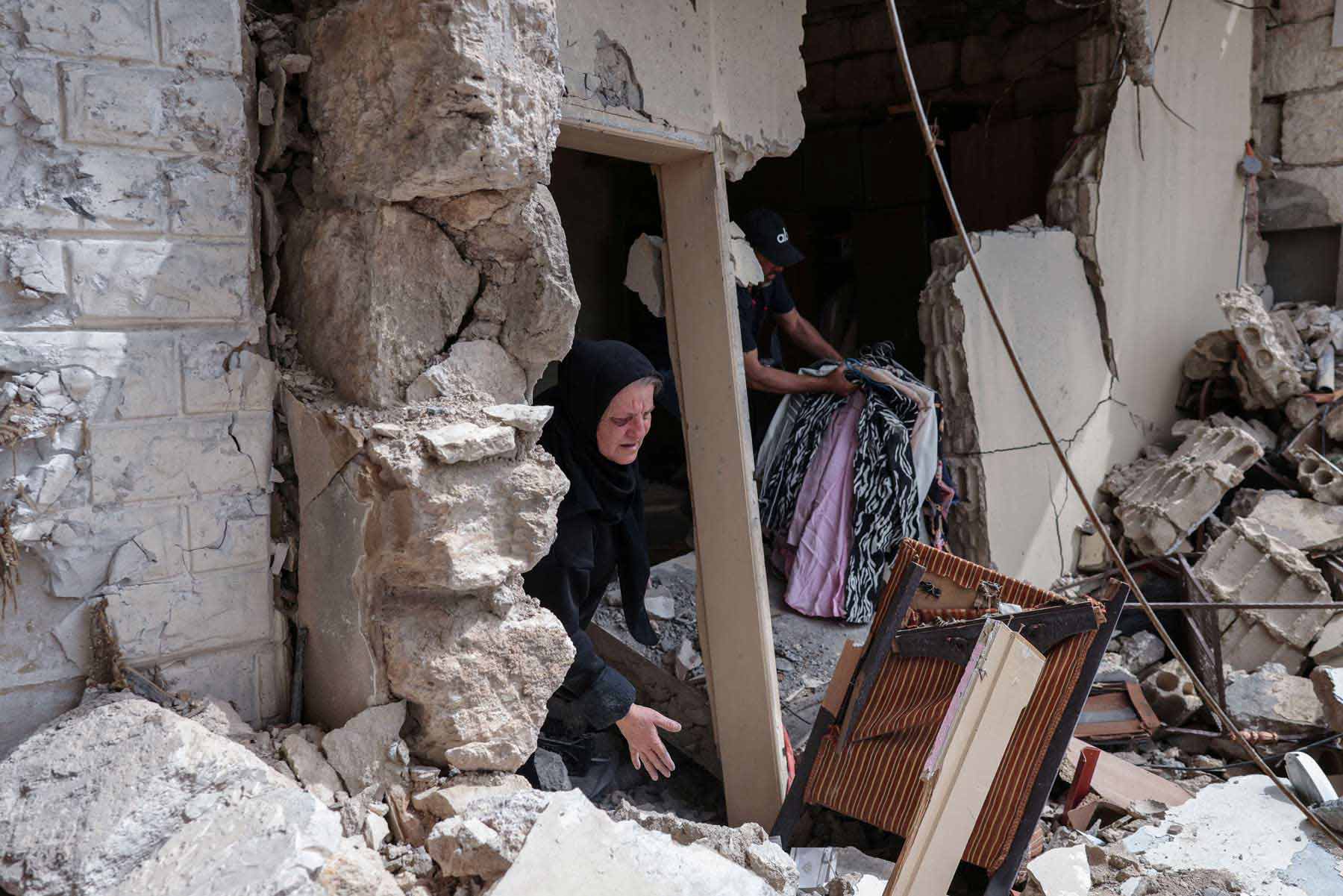 Stay home and risk being killed or flee and risk deepening poverty