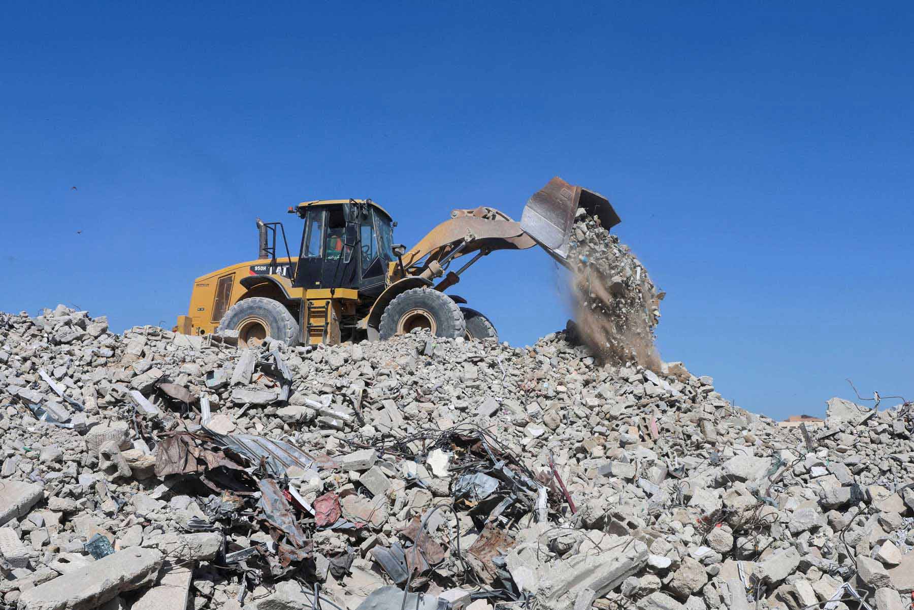 Progress is being slowed by dangers hidden beneath the debris