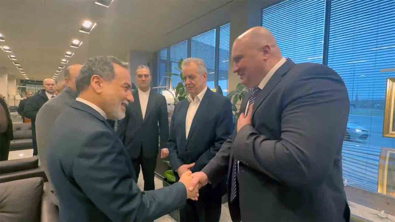Araqchi shaking hands with Russian officials upon his arrival to St Petersburg
