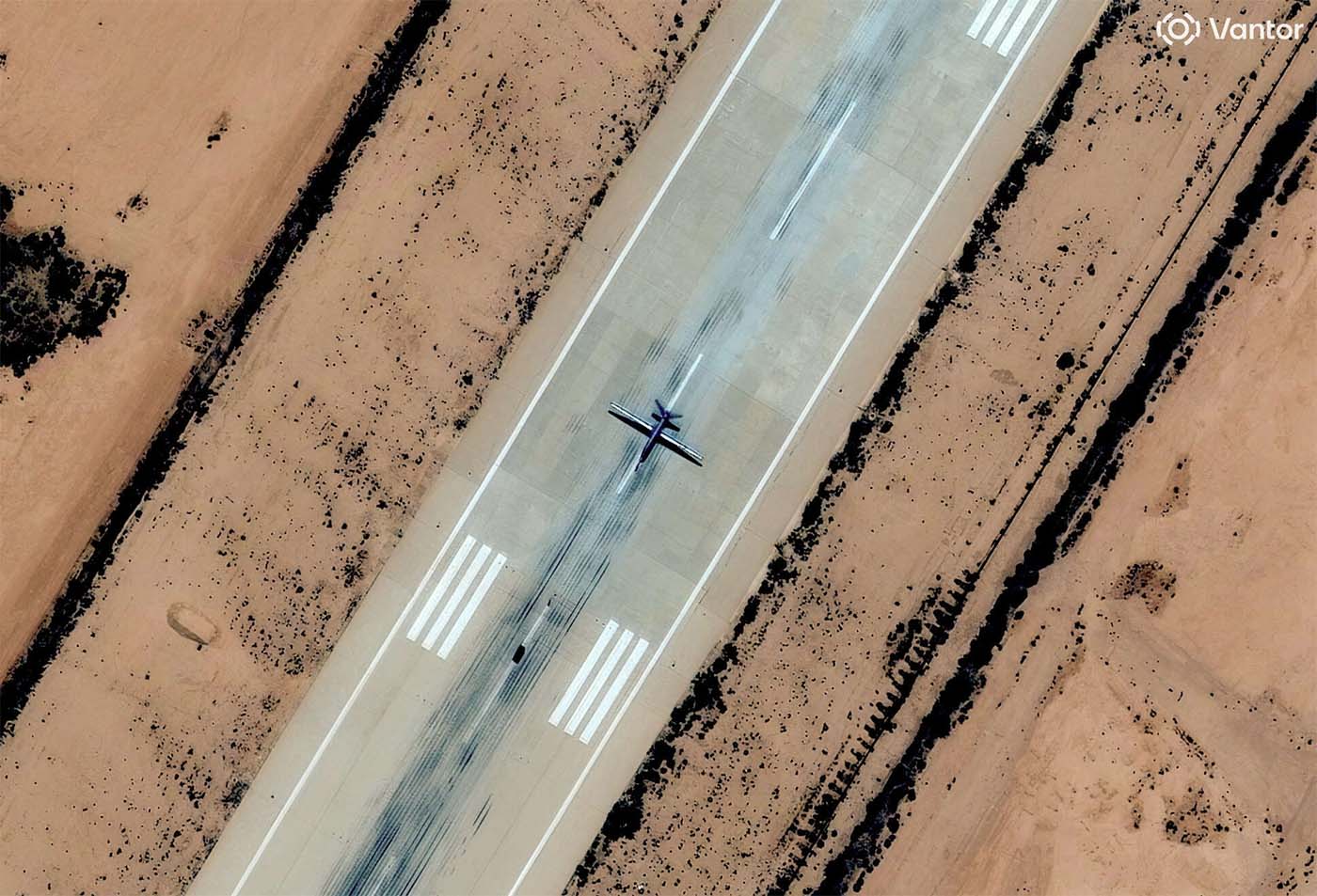 A satellite image shows a combat drone, which experts identified as most likely a Chinese-made Feilong-1, on the runway at Al Khadim airbase
