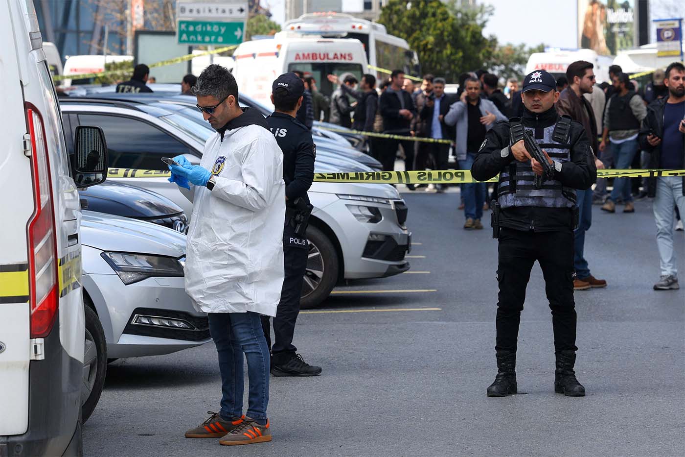 A forensic expert at the scene after gunfire was heard near the building housing the Israeli consulate in Istanbul