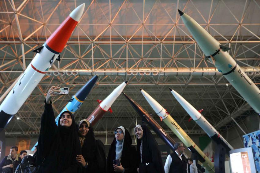 Women take a selfie at the Islamic Revolutionary Guard Corps (IRGC) Aerospace Force Museum in Tehran, November 12, 2025. 