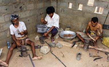 Yemenis hammer blades reformed from metal salvaged from fallen rockets.