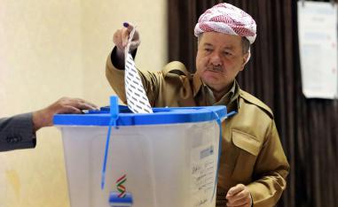  Former leader of the Iraqi Kurdish Regional Government (IKRG) Masoud Barzani gestures after casting his ballot for the parliamentary election at a polling station in Arbil, the capital of the Kurdish autonomous region in northern Iraq