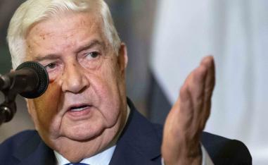 Syrian Foreign Minister Walid Muallem gestures as speaks to the media during the joint news conference with Russian Foreign Minister Sergey Lavrov, following their talks, in Moscow, Russia, Thursday, Aug. 30, 2018