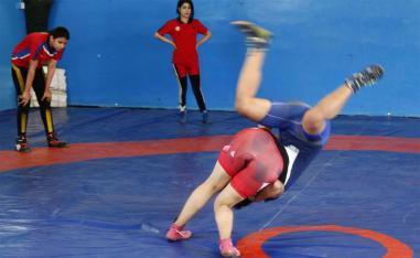 Iraqi female wrestlers practise at a gym in Diwaniyah