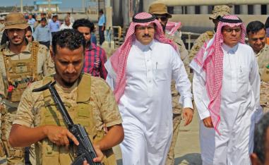 Saudi ambassador to Yemen Mohammed Said Al-Jaber (C) arrives in the southern Yemeni port of Aden to oversee an aid delivery of fuel from Saudi Arabia on October 29, 2018.