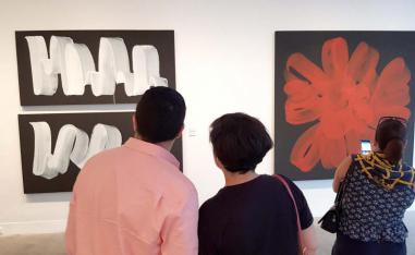 Visitors look at paintings at L’Atelier 21 gallery in Casablanca
