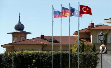 Flags of Russia, Germany, France and Turkey flutter in front of the presidential Vahdettin Mansion prior to a summit on Syria, in Istanbul, Turkey October 27, 2018. 