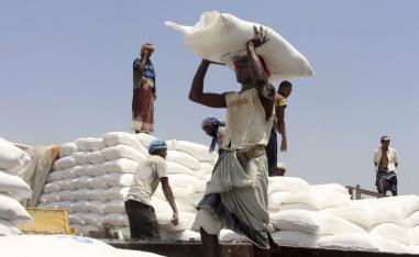 Men deliver UN World Food Programme (WFP) aid in Hajjah, Yemen.