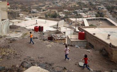 Druze children run at the village of Shreihi in the southern province of Sweida, Syria