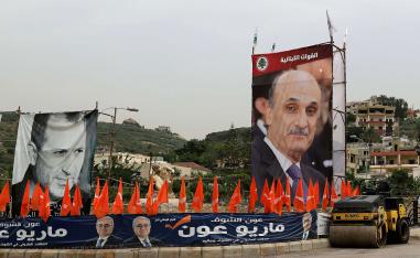 Portraits of the Free Patriotic Movement (FPM) candidate, Foreign Minister Gibran Bassil (L) and the leader of the rival Christian Lebanese forces (LF) group, Samir Geagea (R).