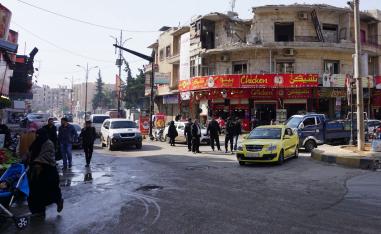 Syrians walk at a local market in the rebel-held northern Syrian city of Idlib on November 17, 2018.