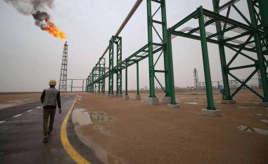  An employee walks at the Zubair oil and gas field in Basra, last May