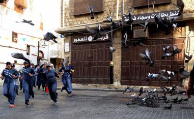  Saudi women jog in the streets of Jeddah's historic al-Balad district on March 8, 2018.