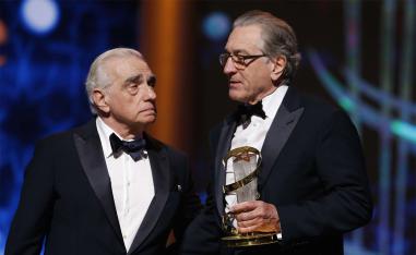 Robert De Niro (R) receiving a tribute award from US director Martin Scorsese to his contribution to acting