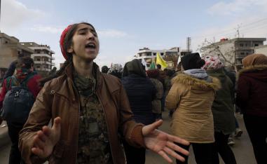 Syrian Kurds take part in a demonstration in the northeastern Syrian Kurdish-majority city of Qamishli on December 28, 2018, against threats from Turkey to carry out a fresh offensive following the US decision to withdraw their troops.
