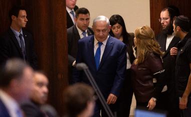 Israeli Prime Minister Benjamin Netanyahu walks in during a session at the Knesset, Israel's parliament in Jerusalem, Wednesday, Dec. 26, 2018.