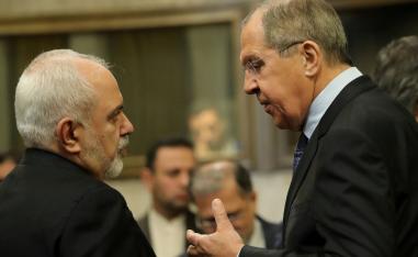 Russian Foreign Minister Sergei Lavrov and Iranian Foreign Minister Mohammad Javad Zarif are seen before a news conference after talks on forming a constitutional committee in Syria, at the United Nations in Geneva, Switzerland, December 18, 2018.