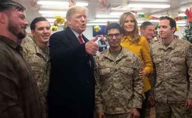  US President Donald Trump and First Lady Melania Trump greet members of the US military during an unannounced trip to Al Asad Air Base in Iraq 