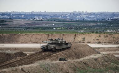 Israeli tank and soldiers take positions on the Israel Gaza border, Friday, Nov. 16, 2018.