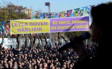 Protesters gather under a banner reading "Leyla Guven is right" during a rally in the Kurdish-majority city of Diyarbakir