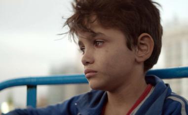 The protagonist is played by a young Syrian refugee, while another young cast member was thrown in jail during the shoot