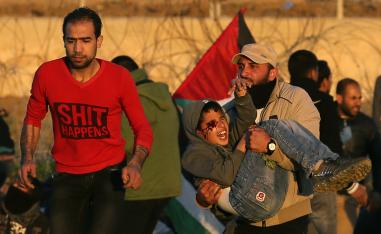 A wounded Palestinian boy is evacuated during a protest at the Israel-Gaza fence, in the southern Gaza Strip January 11, 2019.