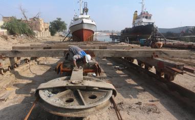 A worker inspects a pulley that pulls ships at a shipyard built by the British Army on Basra's docks in 1918, in Basra, Iraq December 23, 2018.
