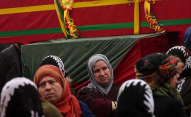 Mourners surround the coffin of a local official, who fighters from the Syrian Democratic Forces (SDF) say was assassinated in a Kurdish-held area in the countryside of Deir Ezzor, during his funeral in northeastern Syrian Kurdish-majority city of Qamishli, on December 31, 2018.
