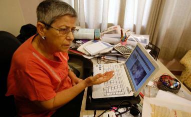 Activist Hana Adwar speaks as she follows online news of the the assassination of Tara Fares in Baghdad