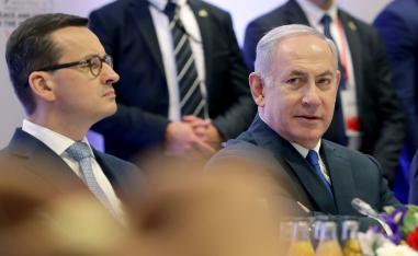 Feb. 14, 2019 photo shows Poland's Prime Minister Mateusz Morawiecki, left, and Israeli Prime Minister Benjamin Netanyahu, right, attend a meeting in Warsaw, Poland.