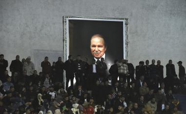 Supporters of Algferia's National Liberation Front (FLN) party, gather at La Coupole arena in the capital Algiers on February 9, 2019, to call upon the current President Abdelaziz Bouteflika (poster) to run for a fifth term in office.