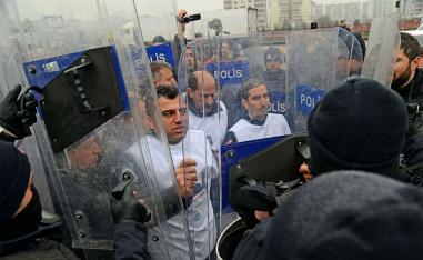 Turkish anti-riot police surround and block members of the pro-Kurdish Peoples' Democratic Party (HDP) during the demonstration