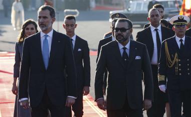 King Felipe VI (L) is greeted by Morocco's King Mohamed VI (R) upon his arrival at Rabat airport