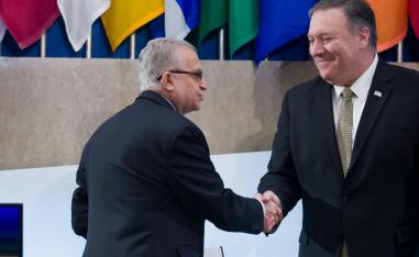Iraqi Foreign Minister Mohamed al-Hakim, shakes hands with Secretary of State Mike Pompeo before al-Hakim speaks during the Global Coalition to Defeat ISIS meeting, at the State Department, Wednesday, Feb. 6, 2019, in Washington.