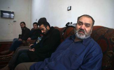 Syrian men suffering from mental issues sit together at al-Waalan special needs centre in northern town of Aldana near Syria's second largest city of Aleppo on February 14, 2019.