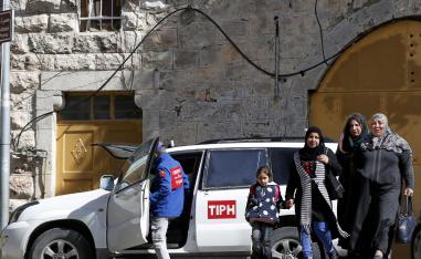Palestinian Territories, Hebron: A Member of the Temporary International Presence in Hebron, (TIPH), gets in one of the organization's vehicles during a tour by the organization in the West Bank on 31 January 2019.