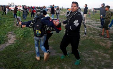 A wounded Palestinian is evacuated during a protest at the Israel-Gaza border fence, east of Gaza City February 22, 2019.