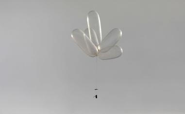 Balloons connected to a device can be seen as Palestinians protest near the fence separating the Gaza Strip on October 19, 2018.