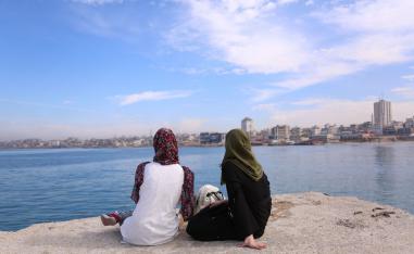 Palestinian Sara Abu Taqea (R), 23, who works in the maternity ward at Gaza's Al-Ahli hospital, and her friend spend time at the seaport in Gaza City, November 27, 2018.
