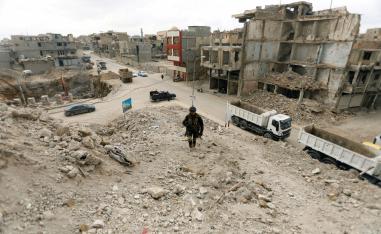 A member of the Iraqi security forces passed by bridges destroyed in the war with Islamic State, in the Old City of Mosul, Iraq, February 27, 2019.