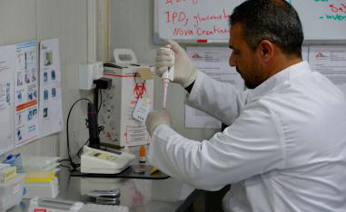 A staff member works at a lab in the Doctors Without Borders (MSF) hospital in Iraq's Mosul, on January 30, 2019.